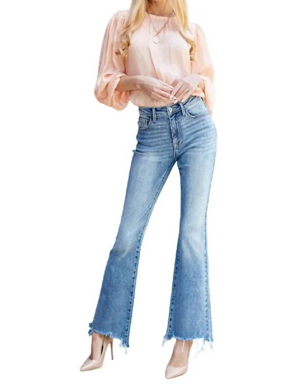 Mid Rise Boot Cut Jeans In Medium